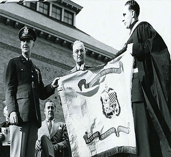 Gonzaga’s 1950 boxing champions are welcomed home under a banner celebrating their national title.