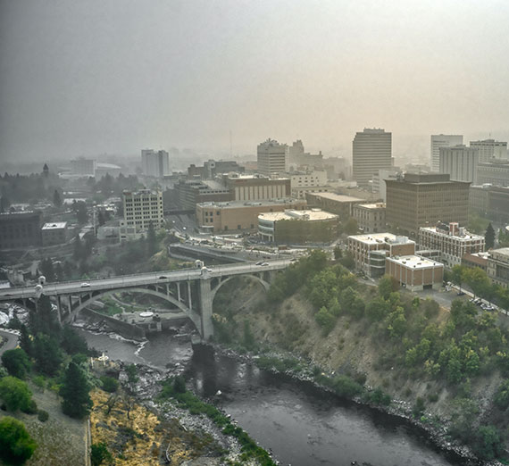 An aerial view of the Spokane River running through downtown Spokane.